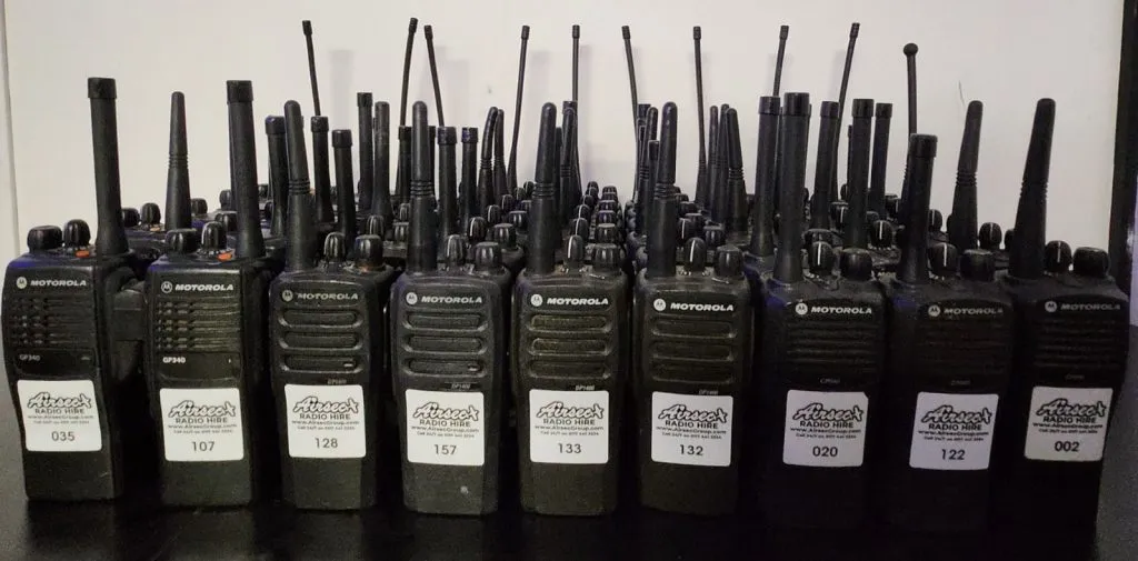 A row of Motorola two-way radios prepared for Airsec radio hire